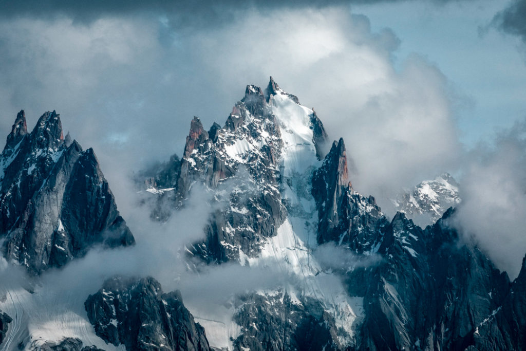 The raw beauty of the Mont Blanc massif with rocky peaks capturing the falling day's light.