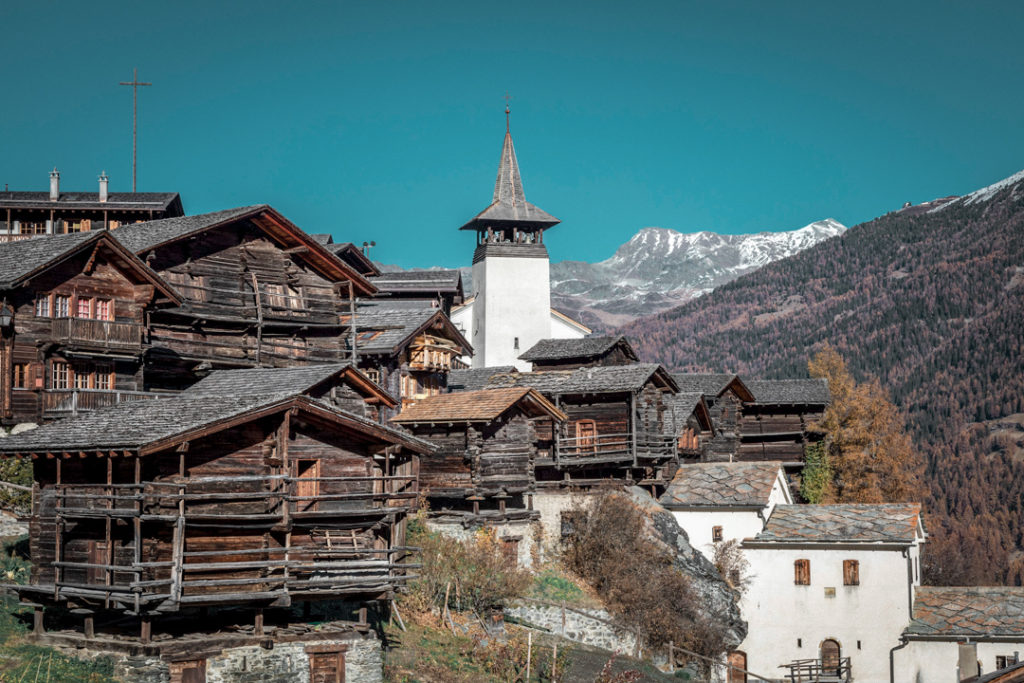 Picturesque view of the mountain village Grimentz, with snow-capped mountains and traditional chalets, captured in November 2018.