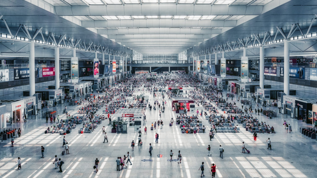 Interior view of Shanghai Railway Station, illustrating the hustle and bustle of passengers.