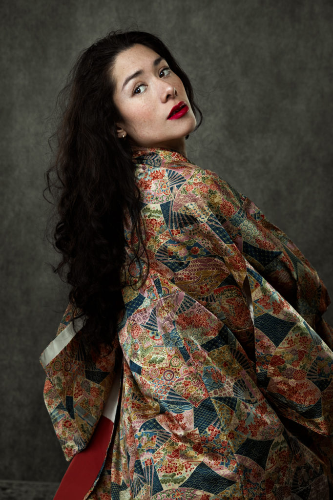 Woman dressed in an elegant kimono, a symbol of determination and vulnerability.